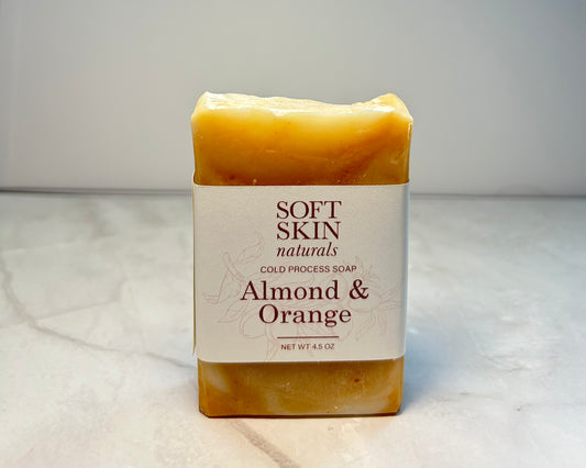 Bar of soap with 'Soft Skin Naturals' label on a marble surface