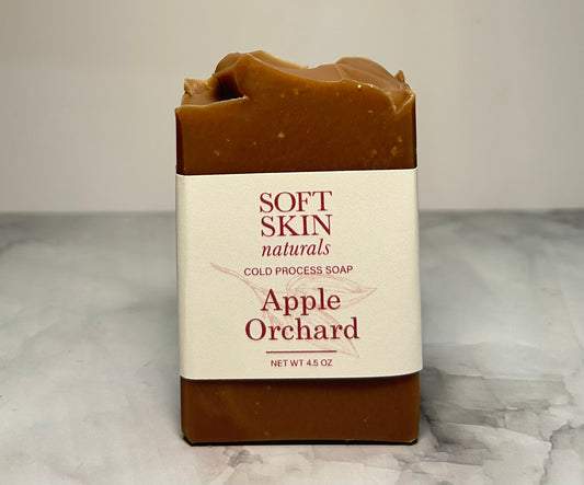 Bar of soap with 'Soft Skin Naturals' label on a marble surface