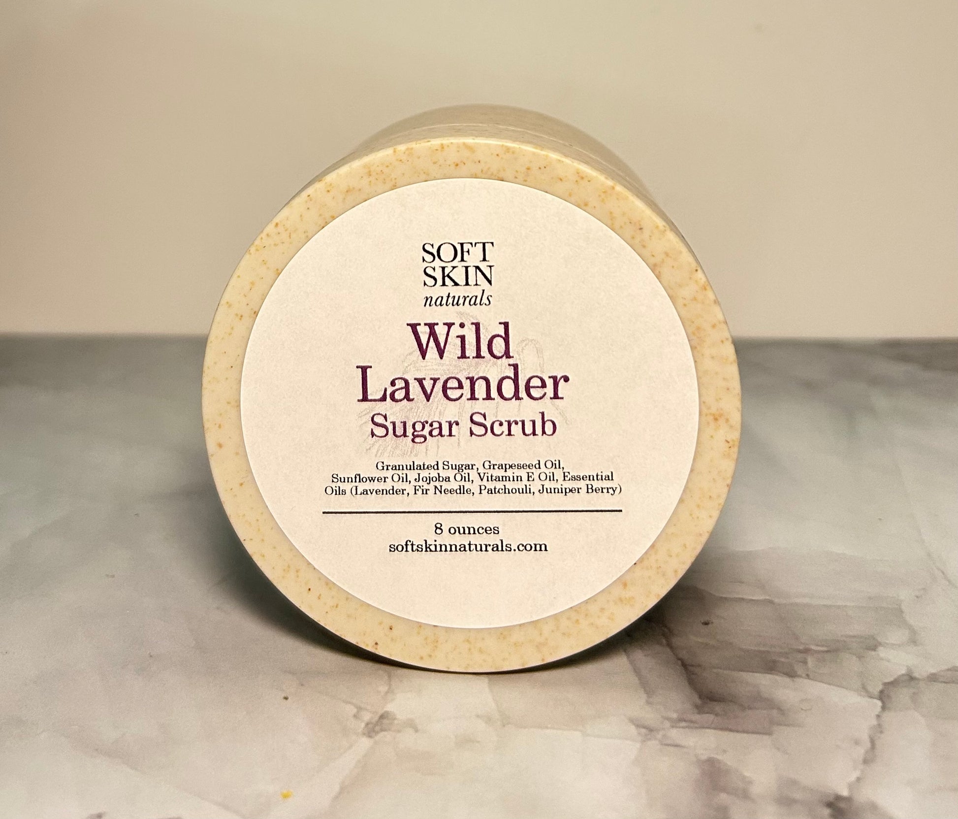 Wild Lavender Sugar Scrub container on a marble surface
