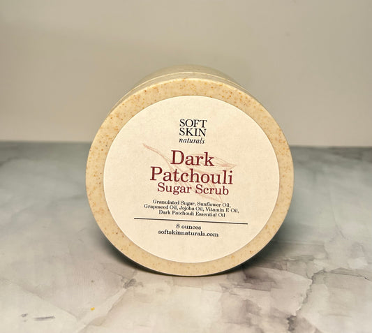 Jar of dark patchouli on a marbled surface