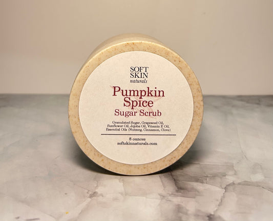 Pumpkin Spice Sugar Scrub container on a marble surface