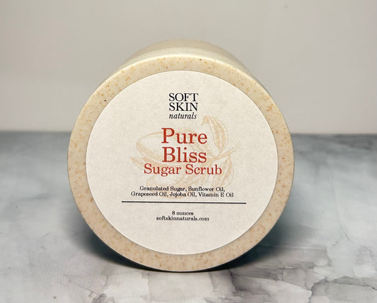 Jar of Soft Skin Naturals Pure Bliss Sugar Scrub on a marble surface