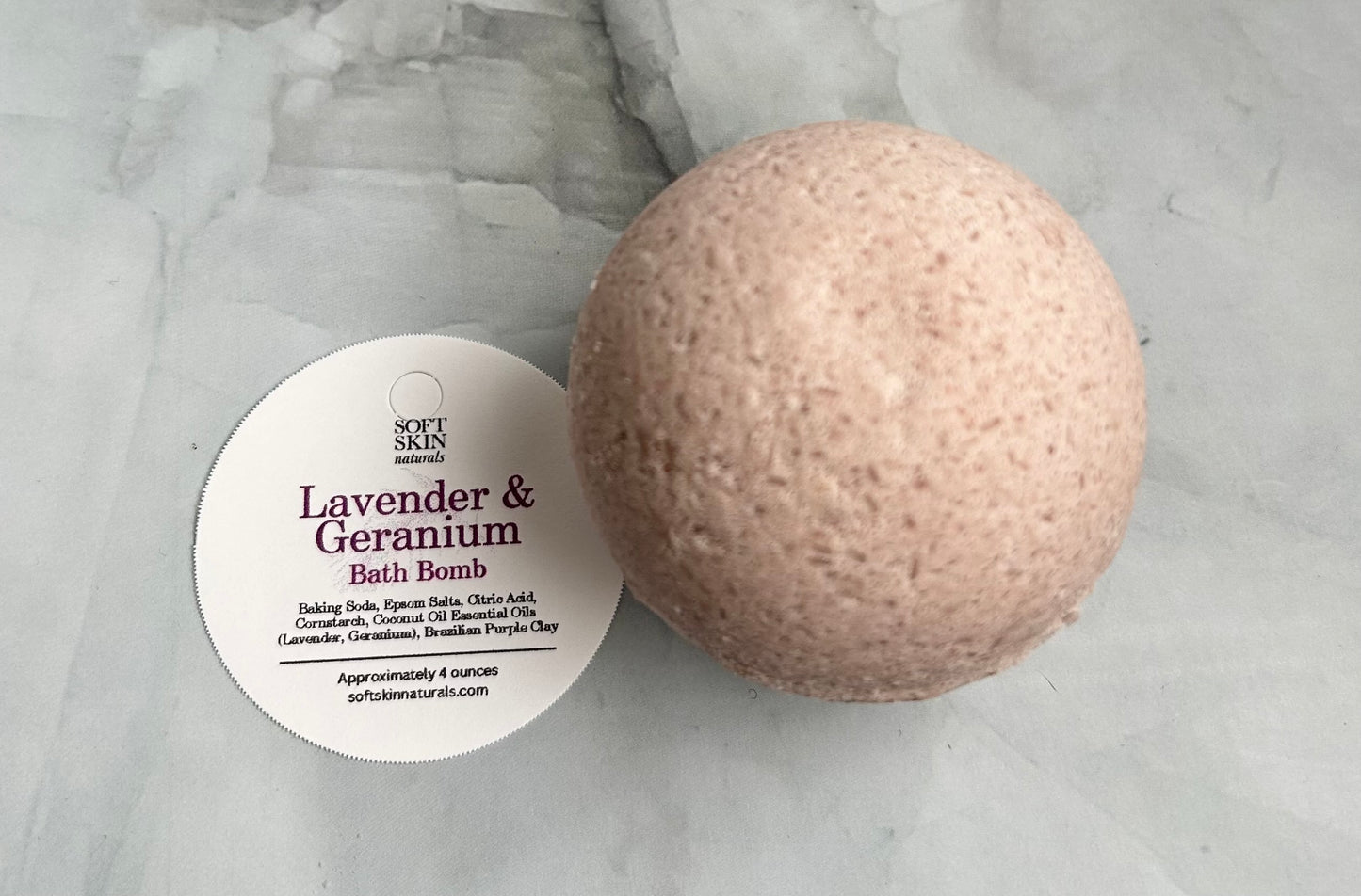 Bath bomb with a label on a marble surface