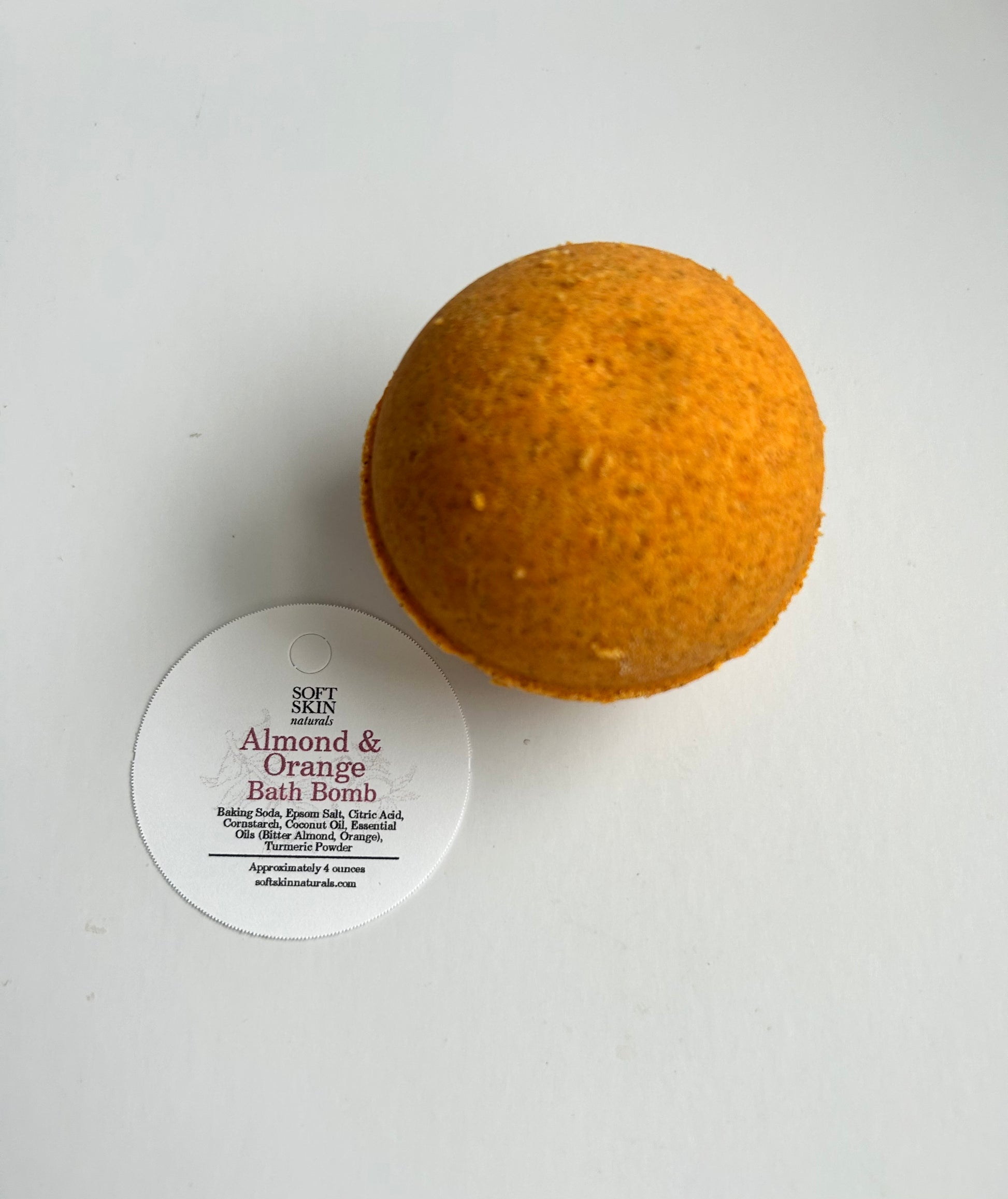 Brown bath bomb with a label on a white background