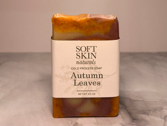 Bar of soap with 'Soft Skin Naturals' label on a neutral background