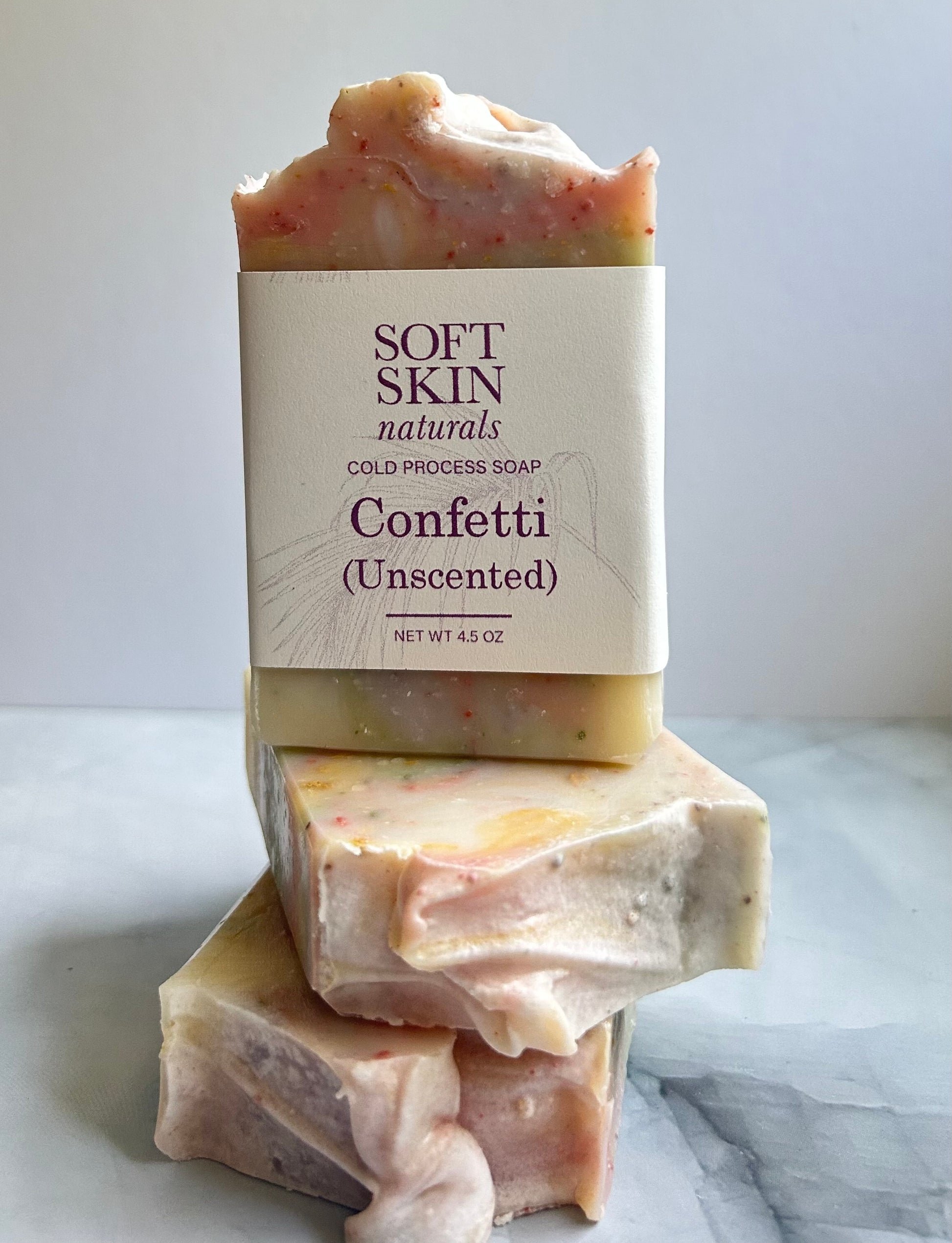 Three milti colored bars of soap
