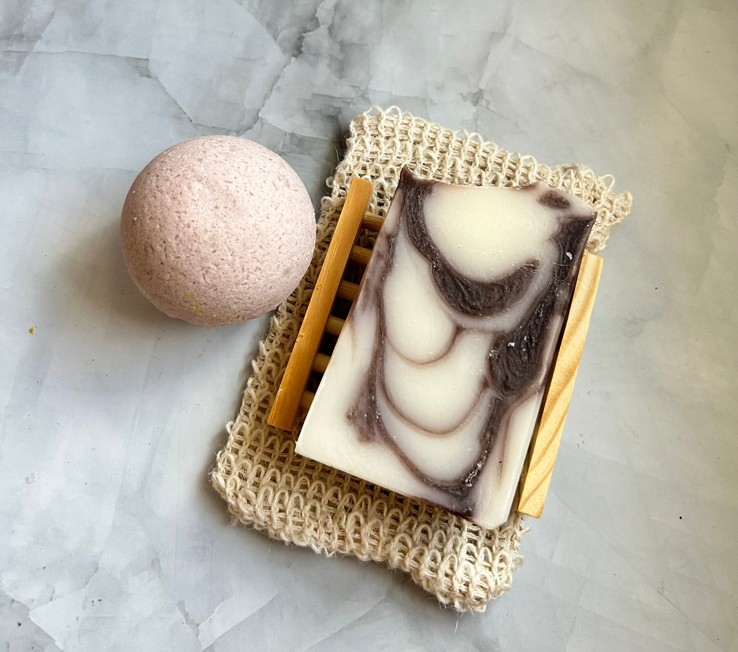 Bar of soap with a marbled design on a textured surface