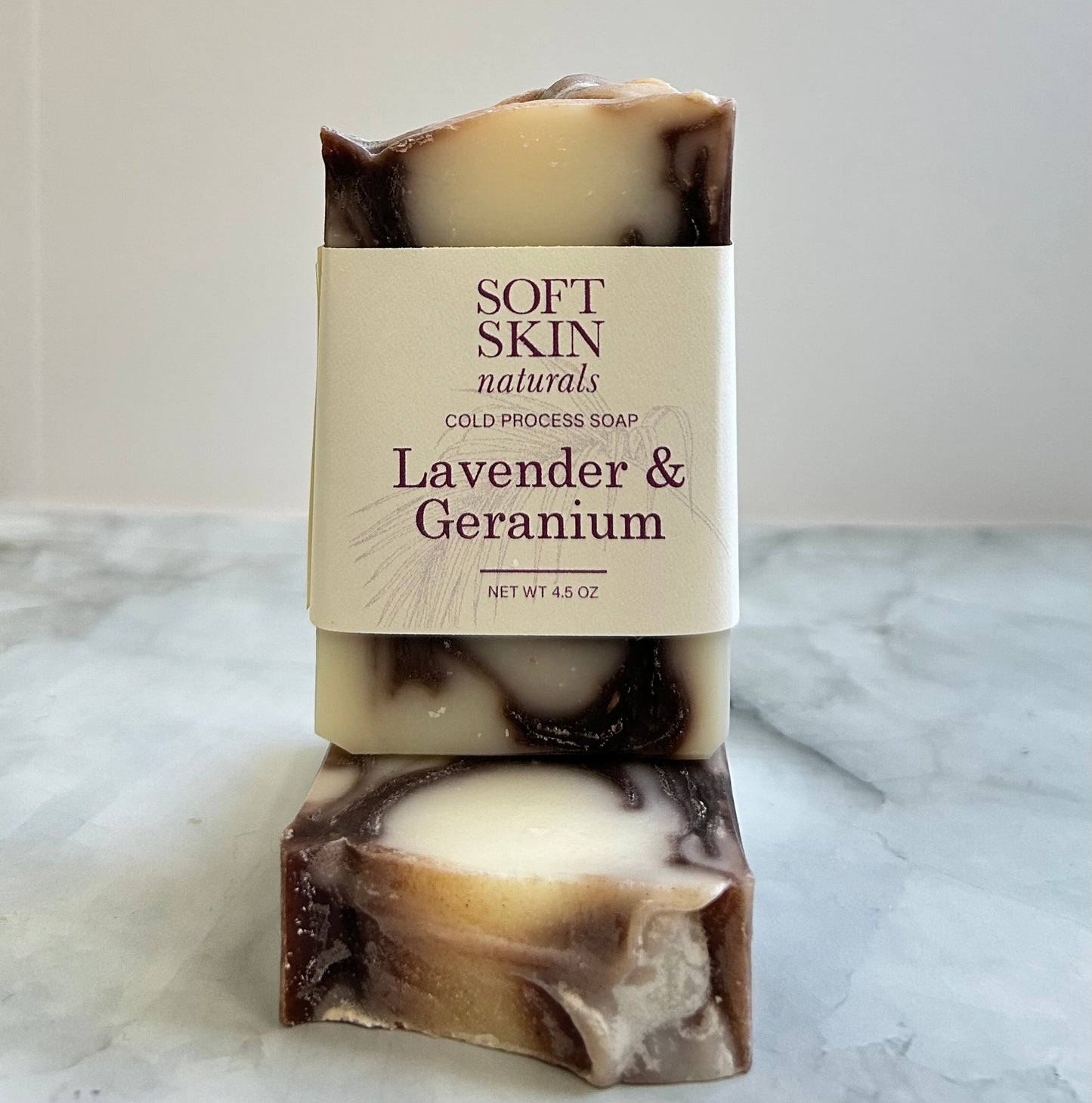 Bar of soap with a visible label on a marble surface