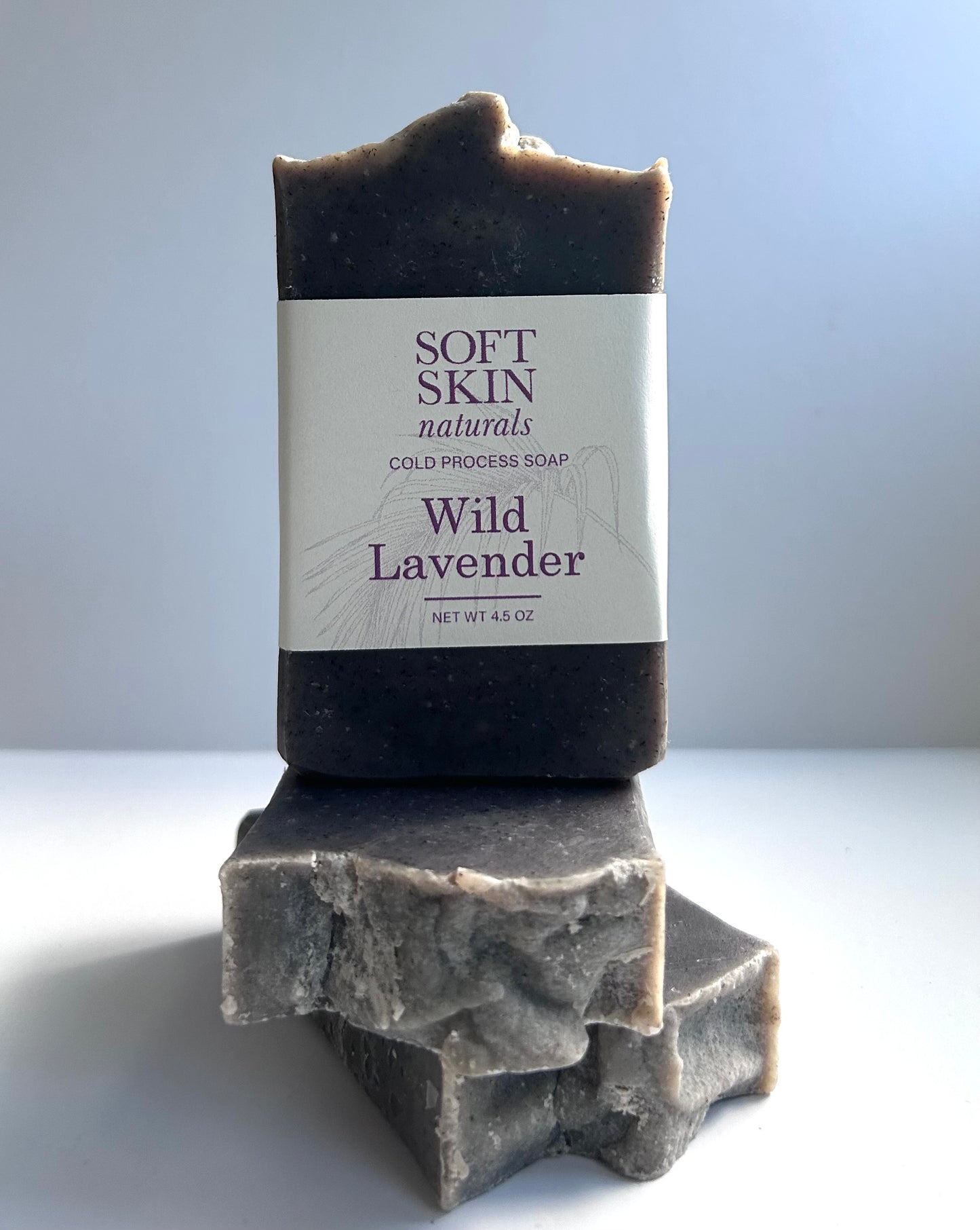 Bar of Wild Lavender soap with Soft Skin Naturals label on a light background