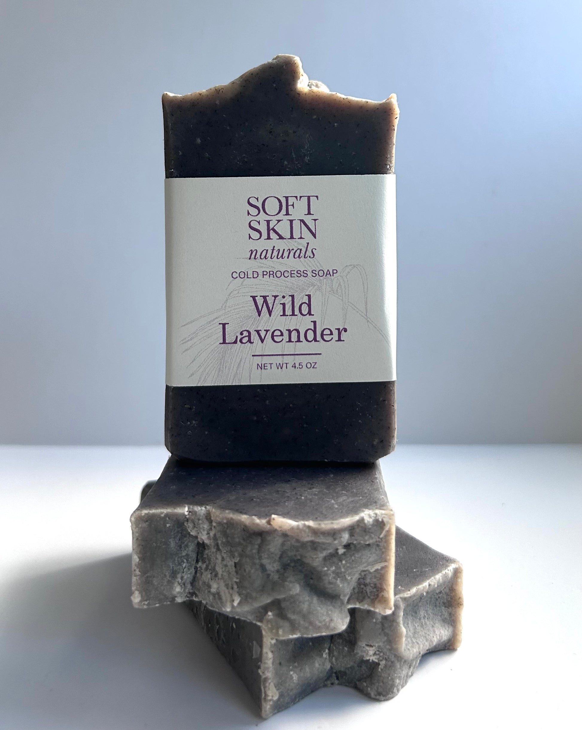 Bar of Wild Lavender soap with Soft Skin Naturals label on a light background