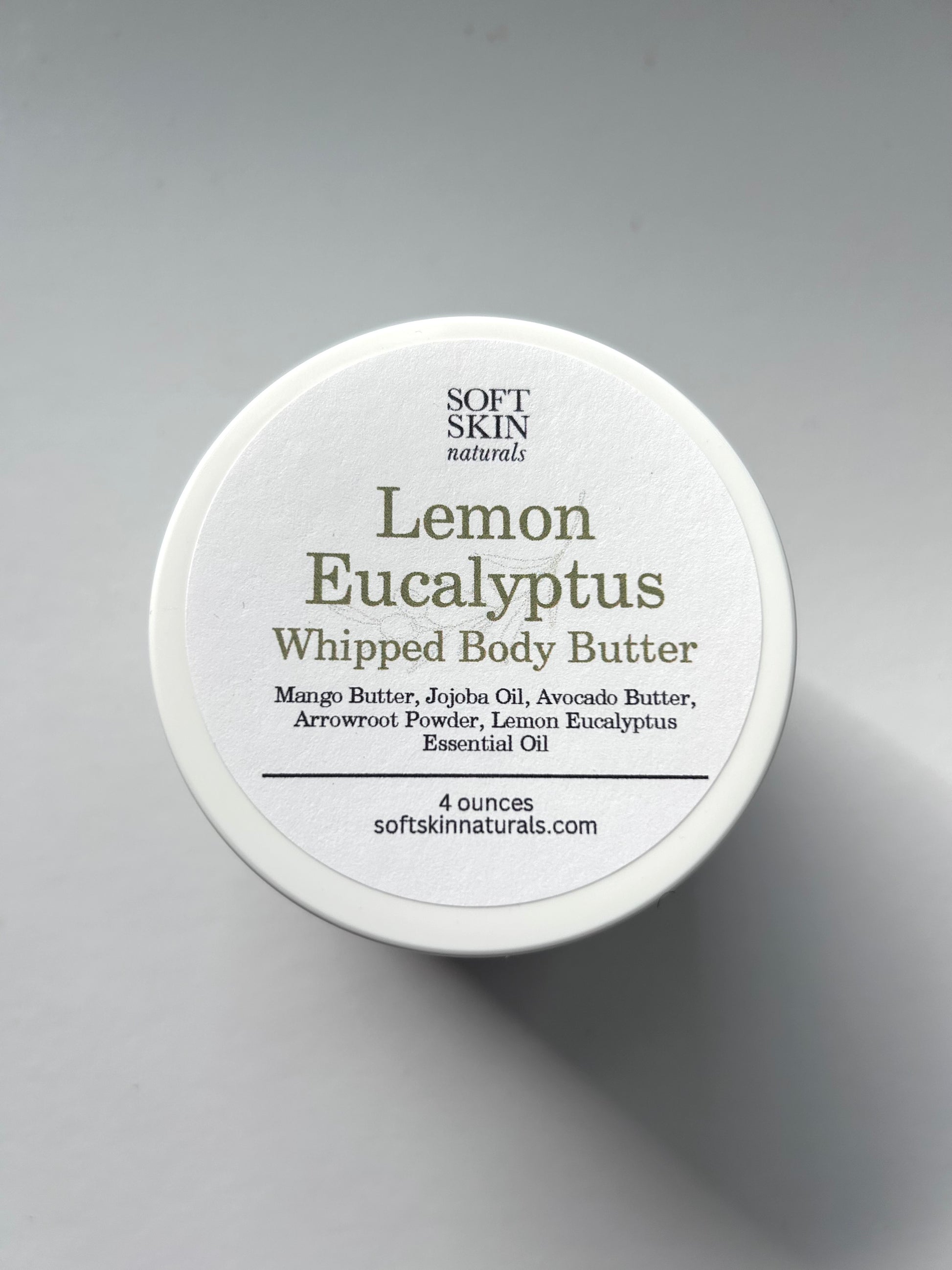 Container of Soft Skin Naturals Lemon Eucalyptus Whipped Body Butter on a gray background