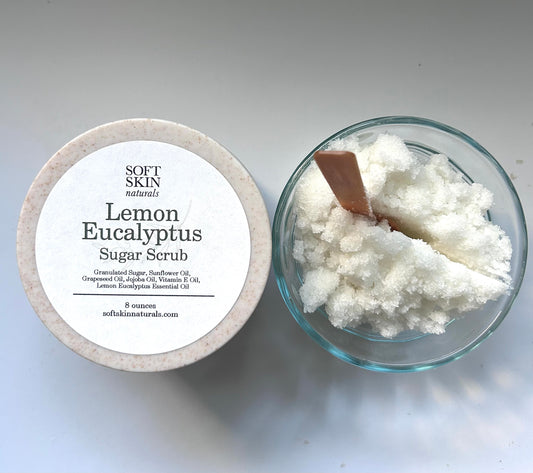 Lemon Eucalyptus Sugar Scrub with a wooden spoon on a light gray background