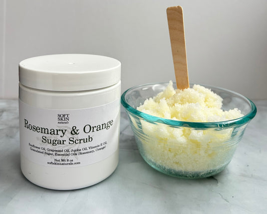 Rosemary & Orange Sugar Scrub container with a bowl of scrub on a white surface
