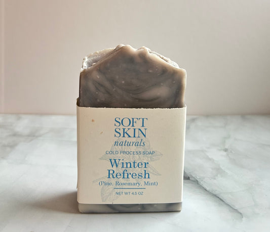 Bar of soap with a label on a marble surface