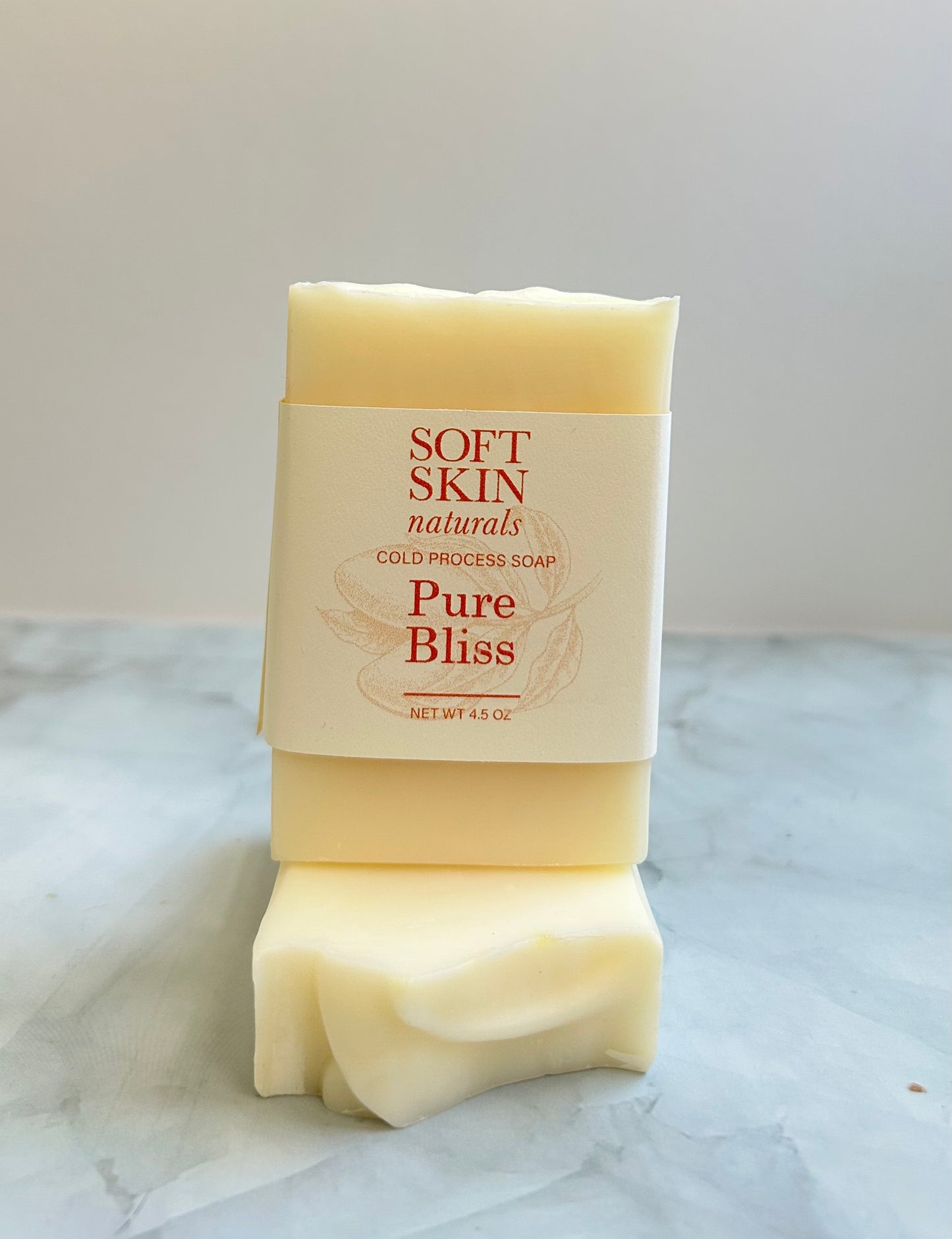 Bar of Soft Skin Naturals Pure Bliss soap on a marble surface